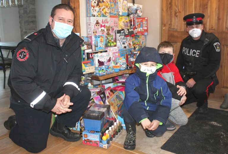 Boys spread holiday cheer through Christmas Angel program